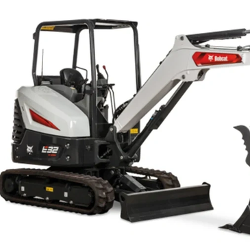 Compact Bobcat excavator with a digging bucket attachment.