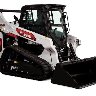 A Bobcat compact track loader with a front bucket attachment.