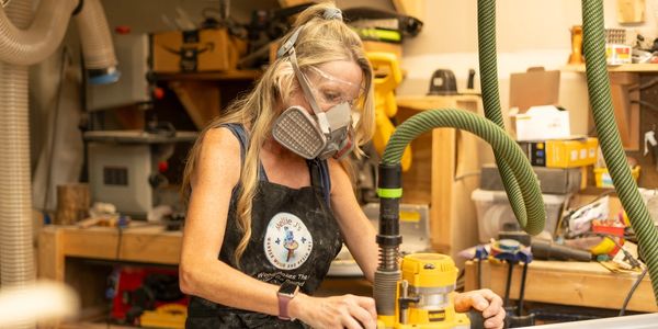 Melinda Rhodes, founder and owner of Millie J's, creating wood projects.