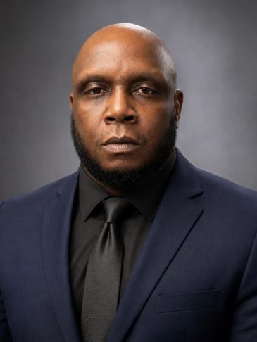 Serious man in a suit and tie.