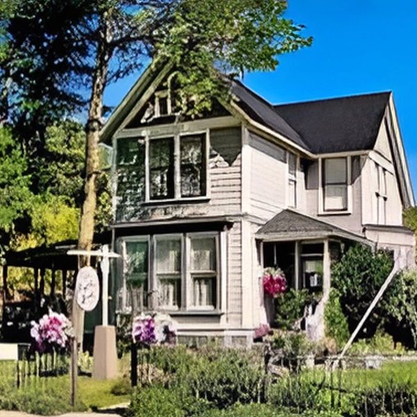 A front view of hotel with garden