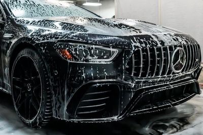 Mercedes Benz snow foam exterior detail inside a wash bay
