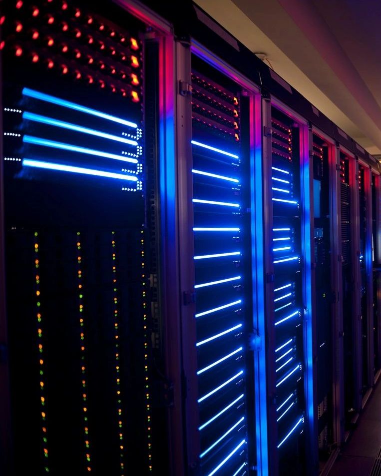 Data center servers with blue and red lights.