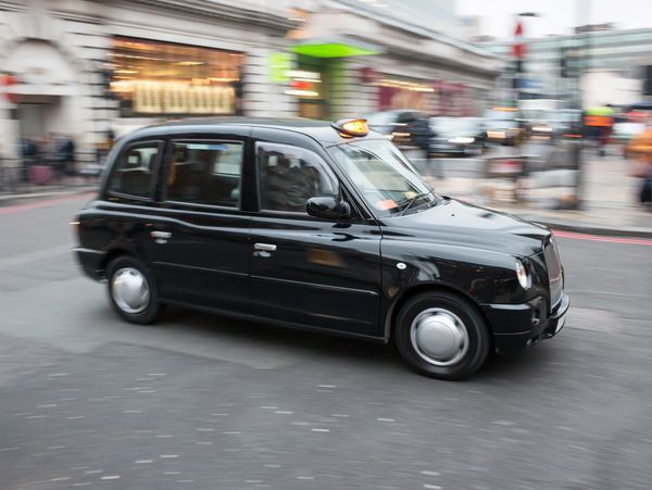 black cab taxi in motion on the street