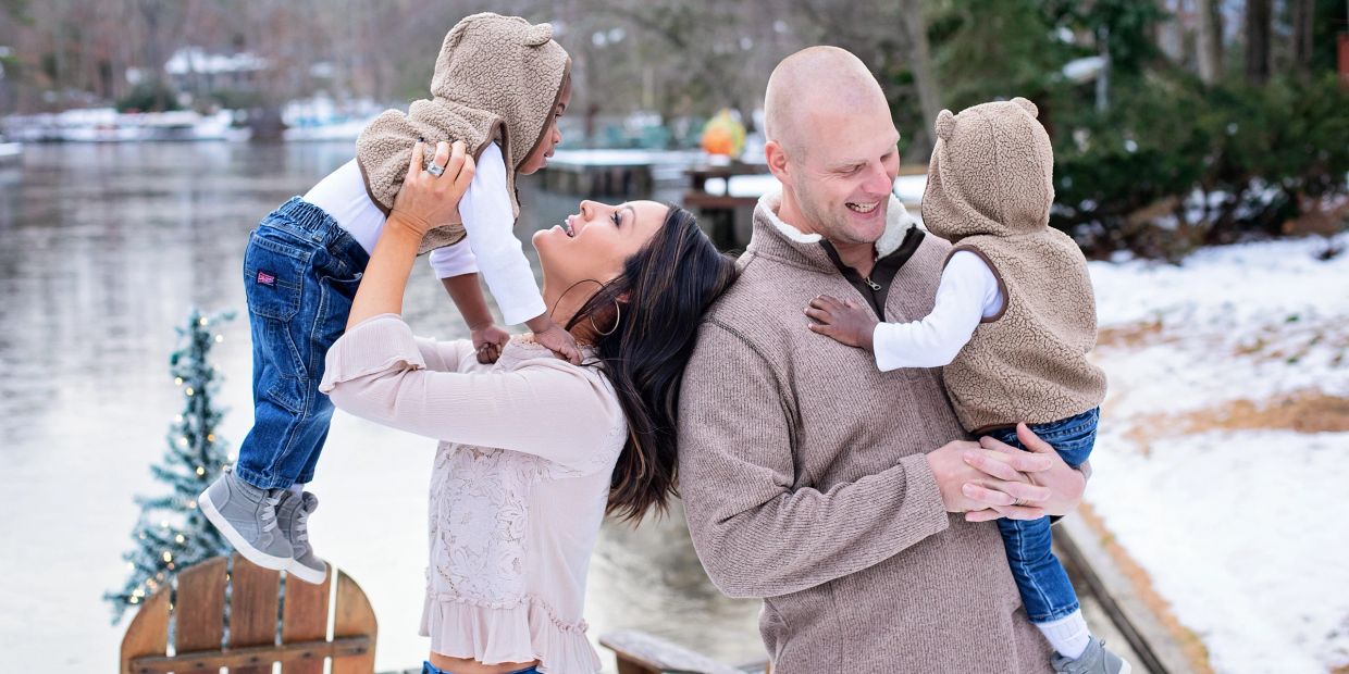 Family enjoying winter time outside by the lake.