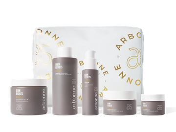 Set of Arbonne skincare products with a branded pouch.
