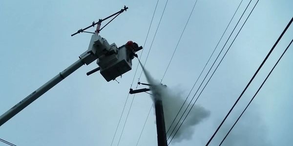 extinguishing a fire on a power pole. emergency response