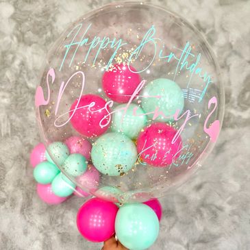 Bright pink and macaron green deco bubble with helium balloon with flamingo decor