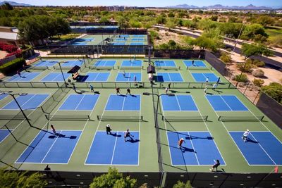 Aerial view of blue and green pickleball courts.