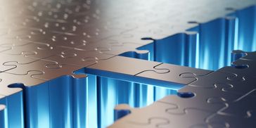 Metal puzzle piece fitting into place over a blue abstract background.