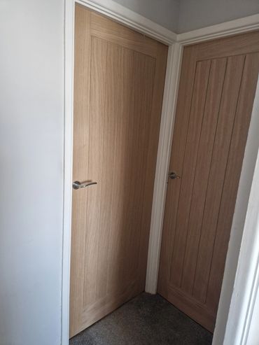 Oak veneer doors fitted,  including chrome scroll handles and hinges 