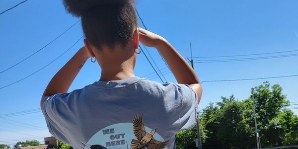 A girl standing in sunlight