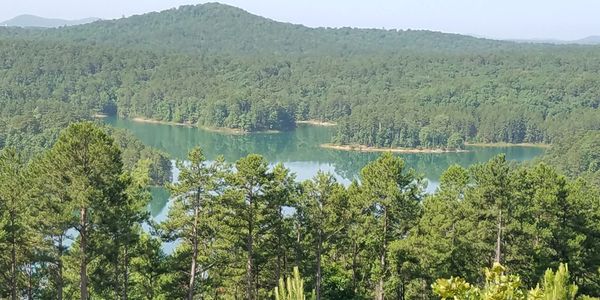 Lake with surrounding hills & trees