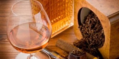 Glass of whiskey, cigar, and tobacco.