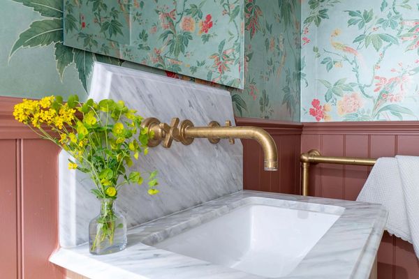 a cloakroom with terracotta tongue and groove panelling in Little Greene Ashes of Roses 