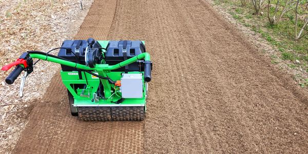 The M58 electric primary seeder in action, offering zero-emission turf preparation for school campus