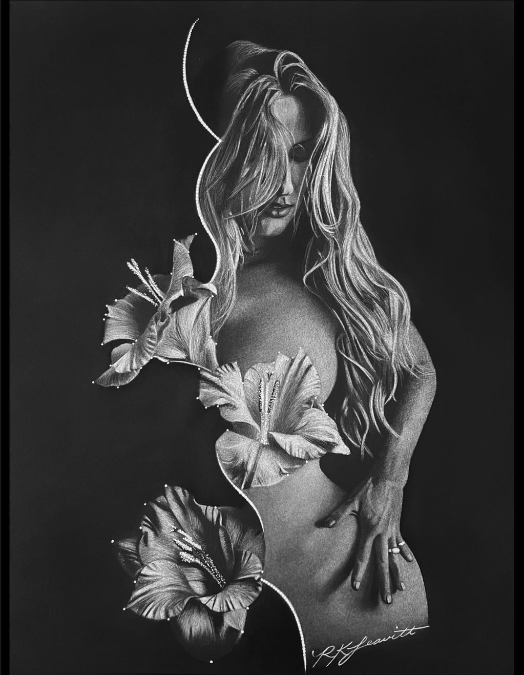 Surreal black and white art blending a woman with flowers.