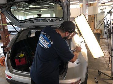 Hail damage repair using paintless dent repair in Frisco Texas