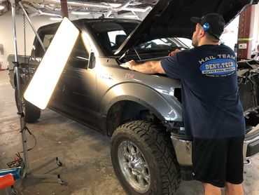 Hail damage repair using paintless dent repair in Plano Texas