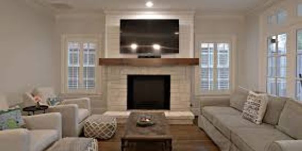 Cozy modern living room with fireplace and large TV.