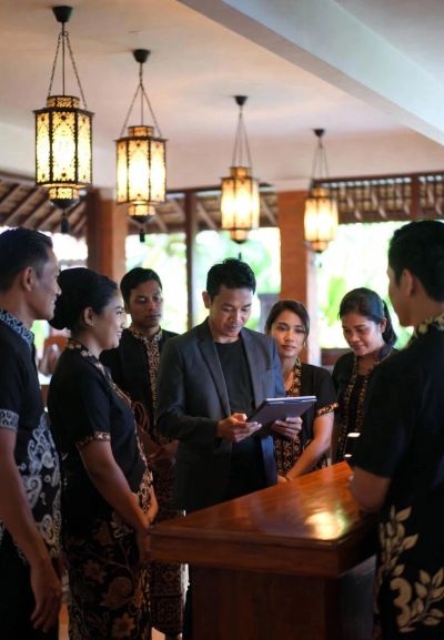 Staff meeting in a traditional setting.