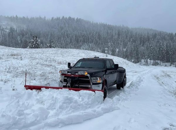Plow truck plowing snow