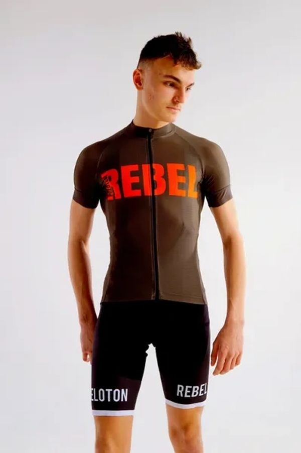 A model is wearing a short sleeved brown and orange Peloton Rebel cycling jersey 