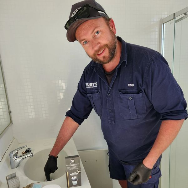 Rob from Burt's Plumbing and Gas Inverell hard at work fixing a sink