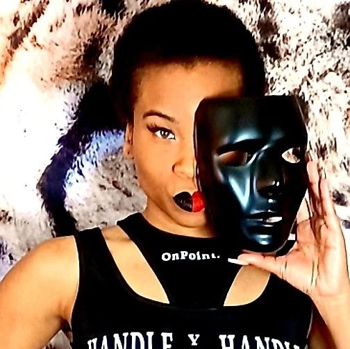 Person holding a black mask covering half their face with dramatic makeup.