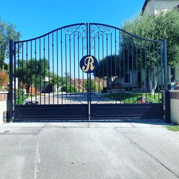 Beautiful custom made property entry gate. Powder coated black with a gold monogram. Newhall, Ca