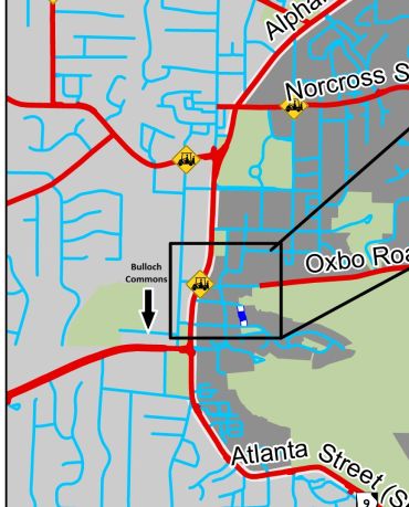 Map section showing street names and landmarks with a black highlighted area.