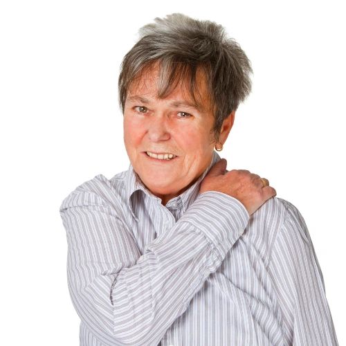 Woman holding her shoulder and wincing in pain