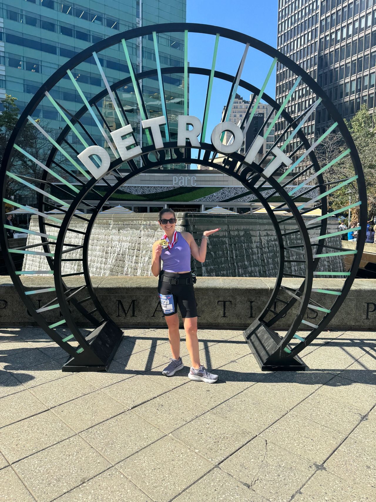 Val celebrating a successful marathon in Detroit