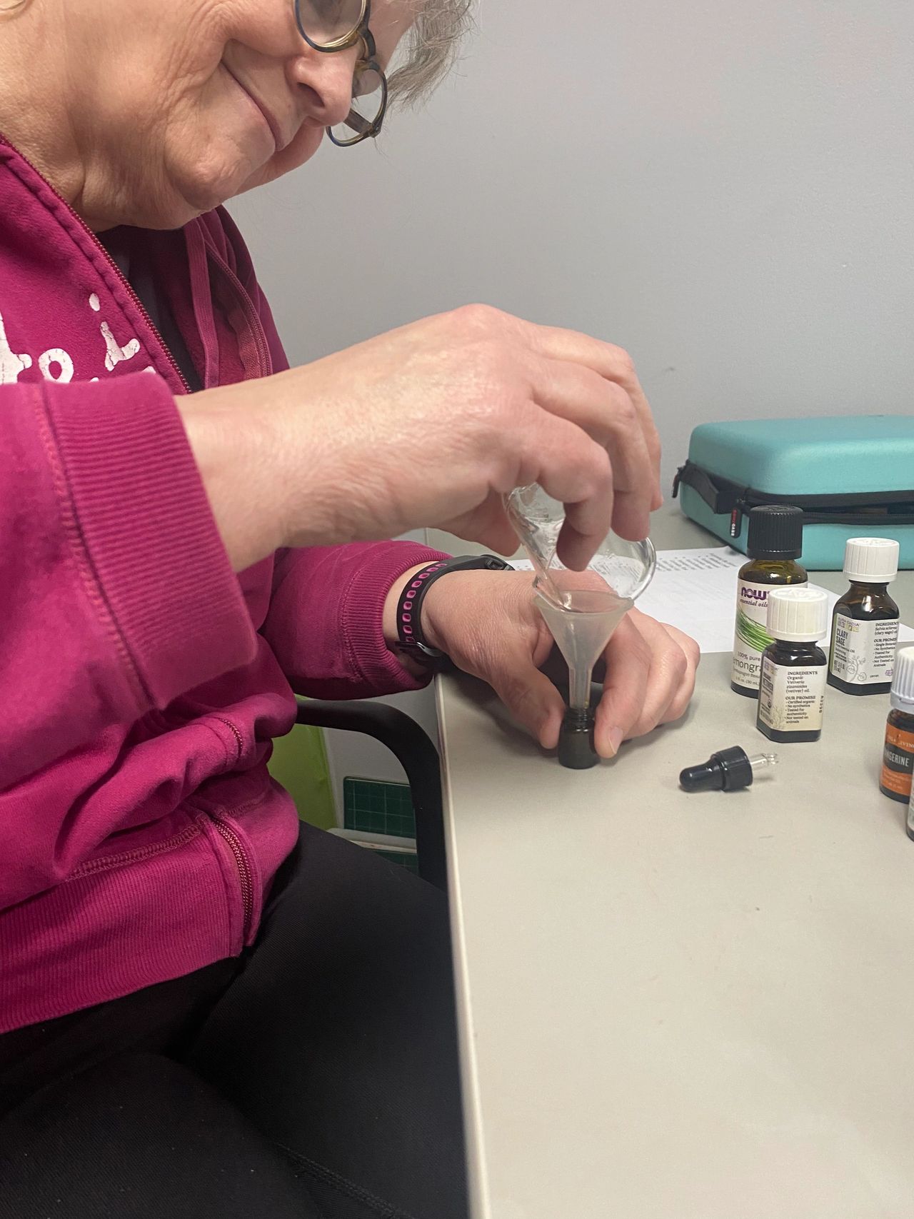 Picture of workshop participant making their own custom essential oil blend