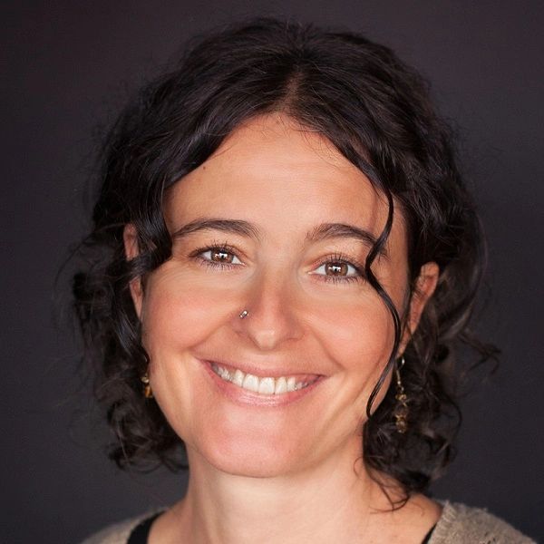 A head and shoulders shot of Seva Van Why smiling at the camera