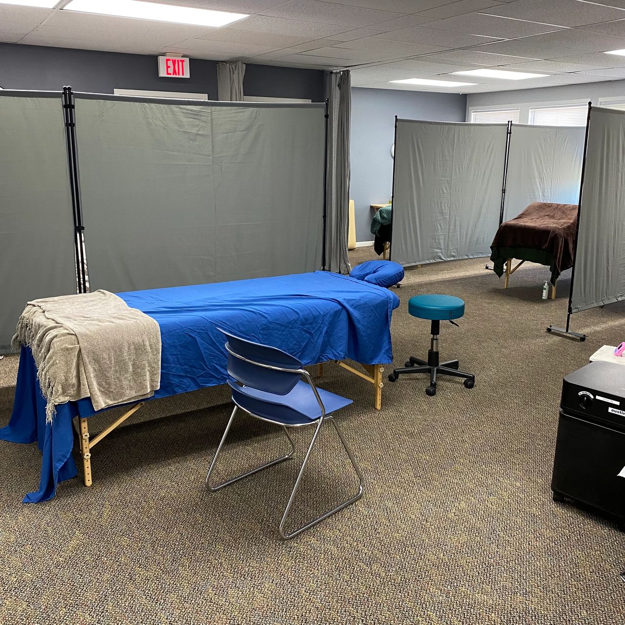 Image of two massage rooms set up in the student clinic
