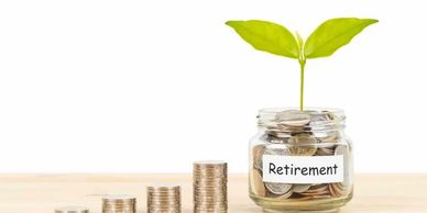 A jar with money in it with retirement written on the jar