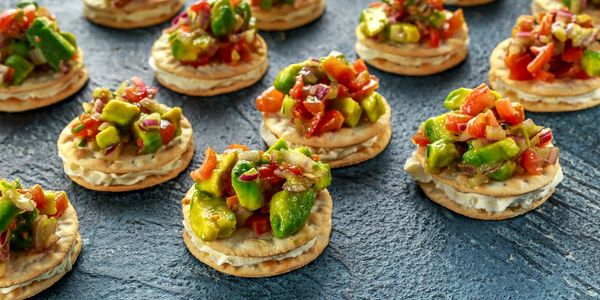 Salsa canape cracker appetizers with soft cheese