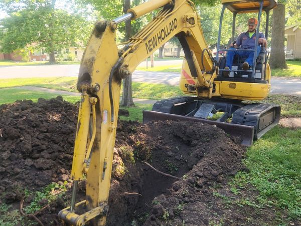 Vorhees plumbing worker digging excavator sewer repair work
