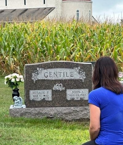 Cindy in front of the stone that gave her inspiration to start Forever Rose Headstone Cleaning