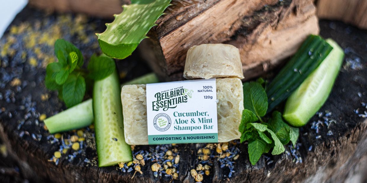Cucumber, Aloe Vera, Fresh Mint Shampoo bar with textured wood and botanicals for visual interest
