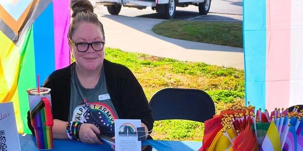 Image features Erin Bailey (She/Her) Executive Director of The Glass House Resource Center.