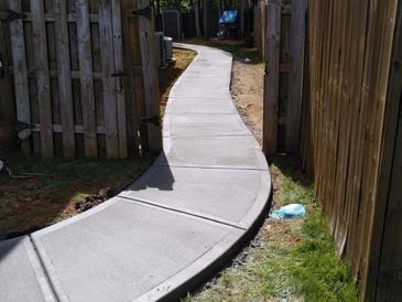 person holding black and green power tool