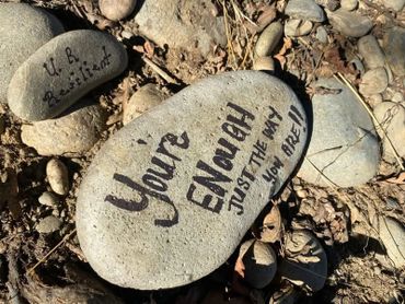 A rock with an inspirational message about self-worth written on it.