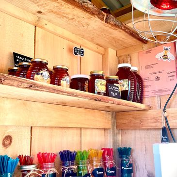 Honey and honey sticks warming in the honey house. 