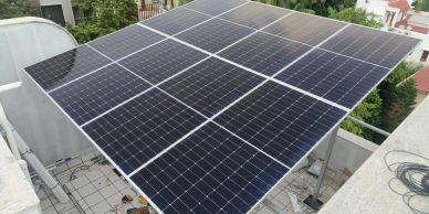 A rooftop solar panel system under daylight.