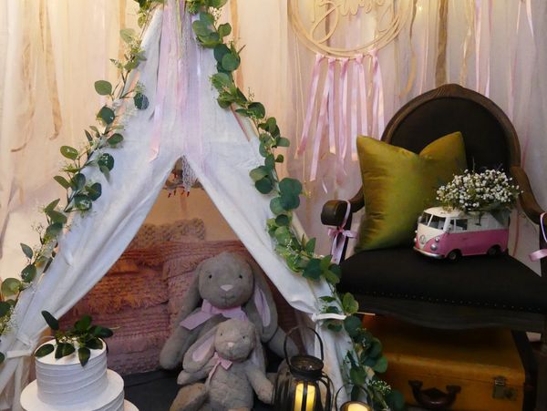 Canvas teepee with garlands and plush toys