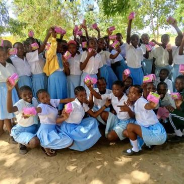 School girls got 100 packs of sanitary towels.