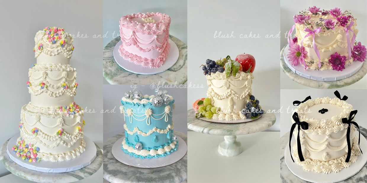 A tall three-tiered white cake decorated with pastel-colored flowers.