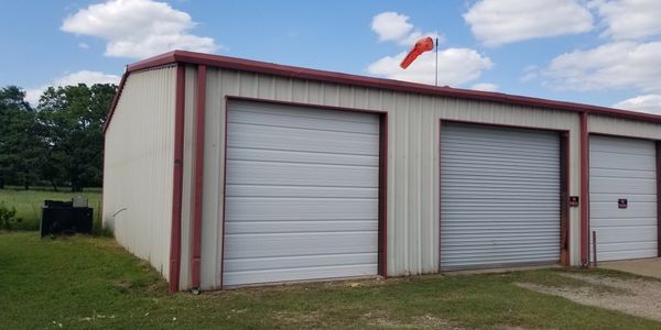 Three Commercial Roll Up Garage Doors White